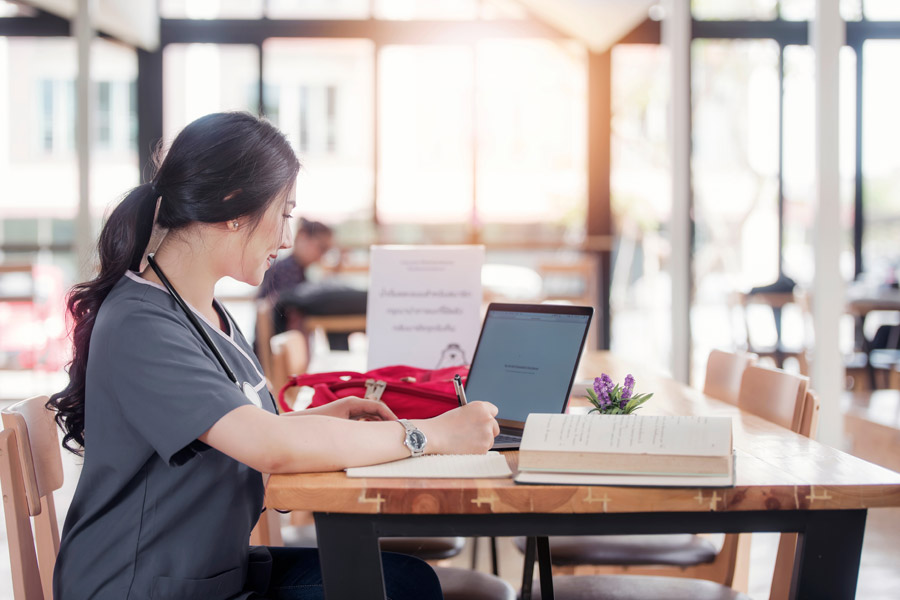 Nurse Working on Scholarships